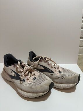 Brooks women's running shoes in pale pink and charcoal accents